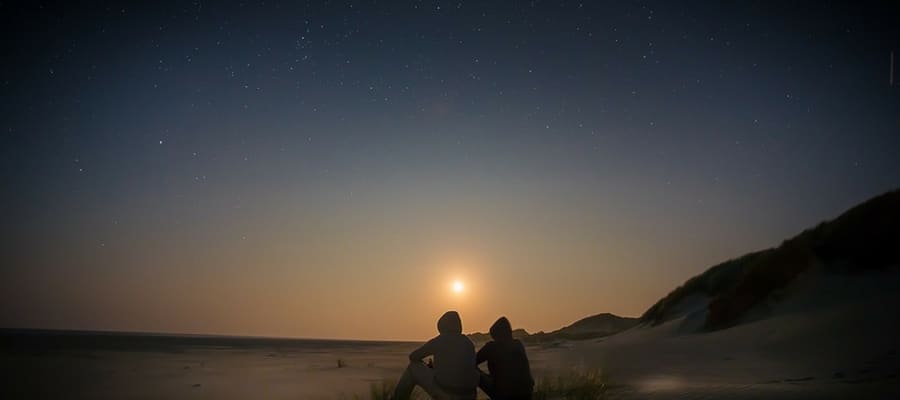 Two people stargazing