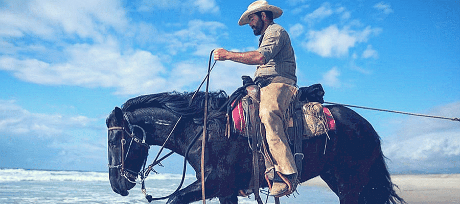 Cowboy horseback riding