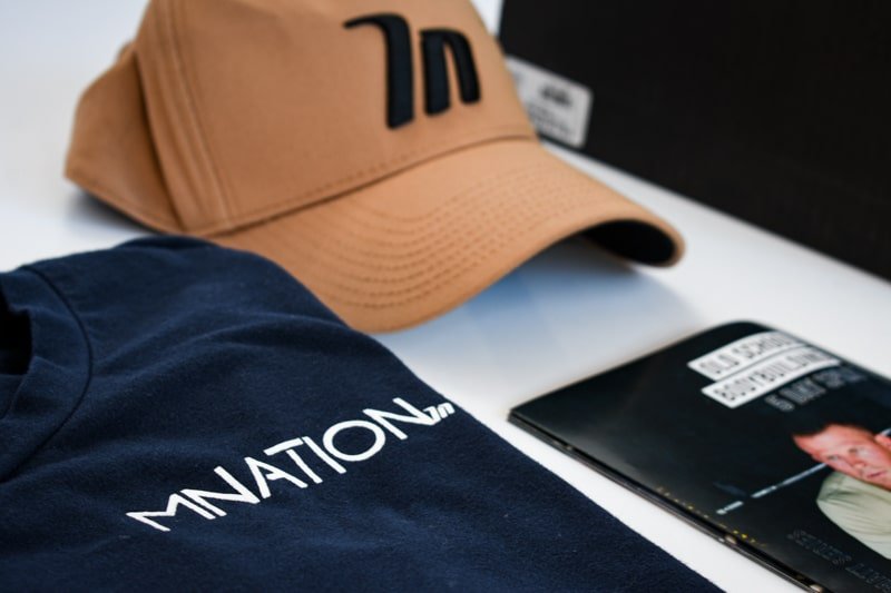 a frame hat with blue muscle nation shirt