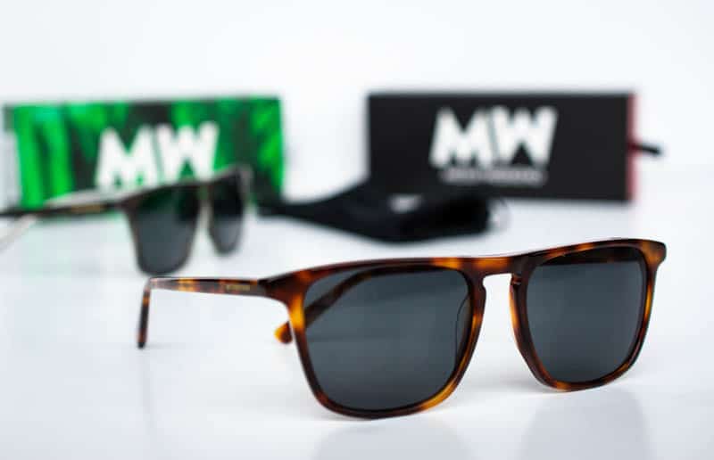angled jack sunglasses tortoise shell color with green and black boxes on white background