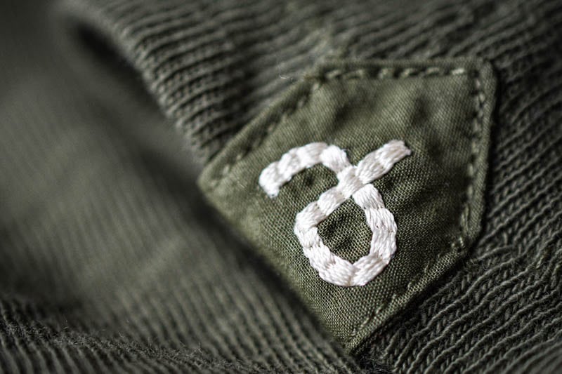 closeup of rb patch on green rag and bone tshirt