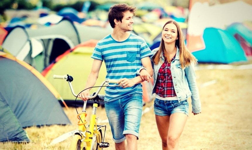 Couple, man with capris long shorts at summer festival