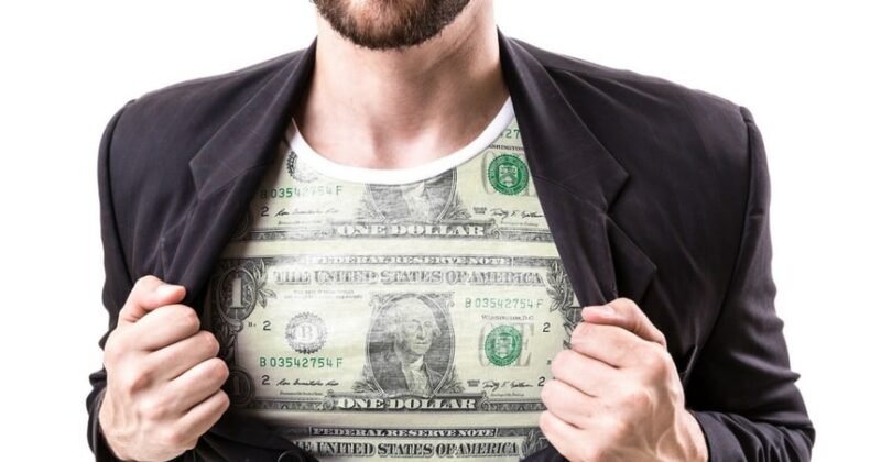 Man in shirt with dollar bill on it and jacket