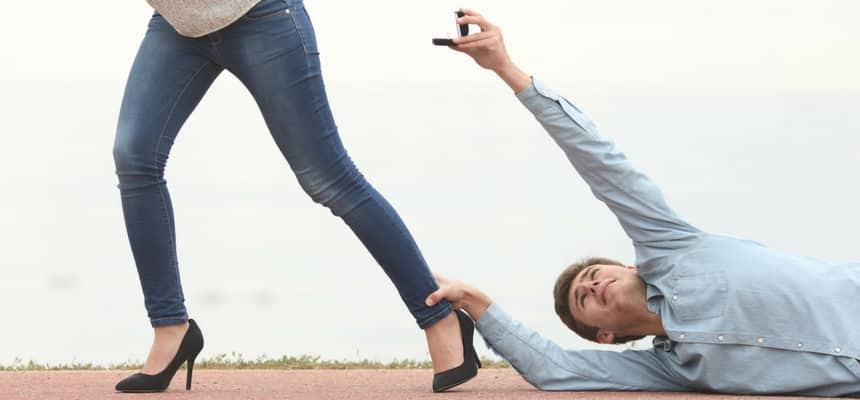 Man desperately trying to propose to a woman who is running away