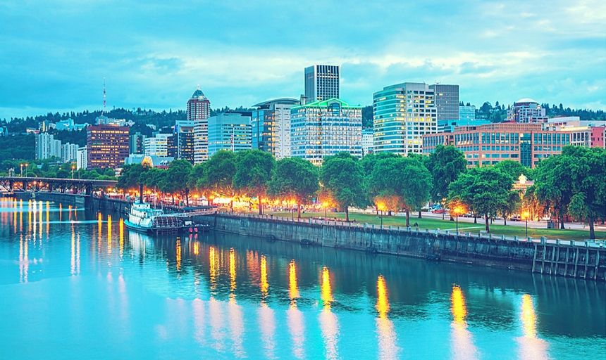 Downtown Portland cityscape with trees and river