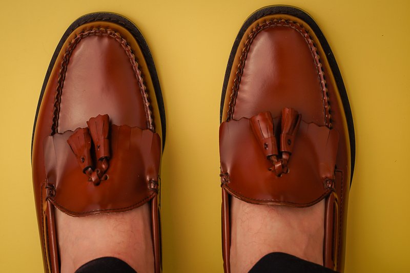GH Bass loafers on yellow background