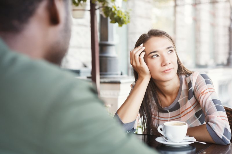 Girl bored on coffee date