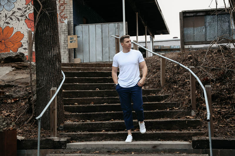 Goodlife Clothing t shirt and pants walking down steps