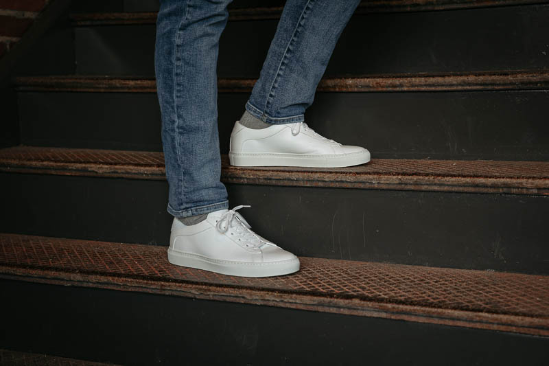 KOIO capri triple white sneakers on stairs
