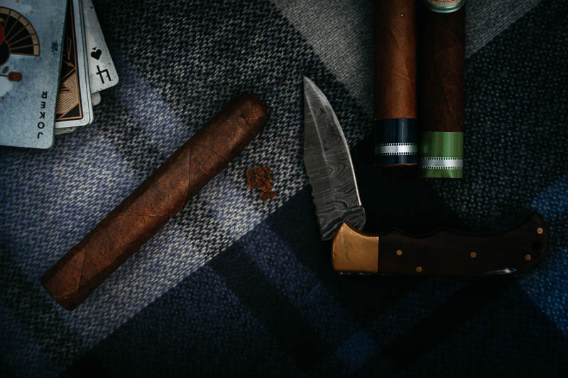 La Aurora cigar cut with knife