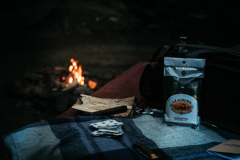 La Aurora cigars with camp fire in background