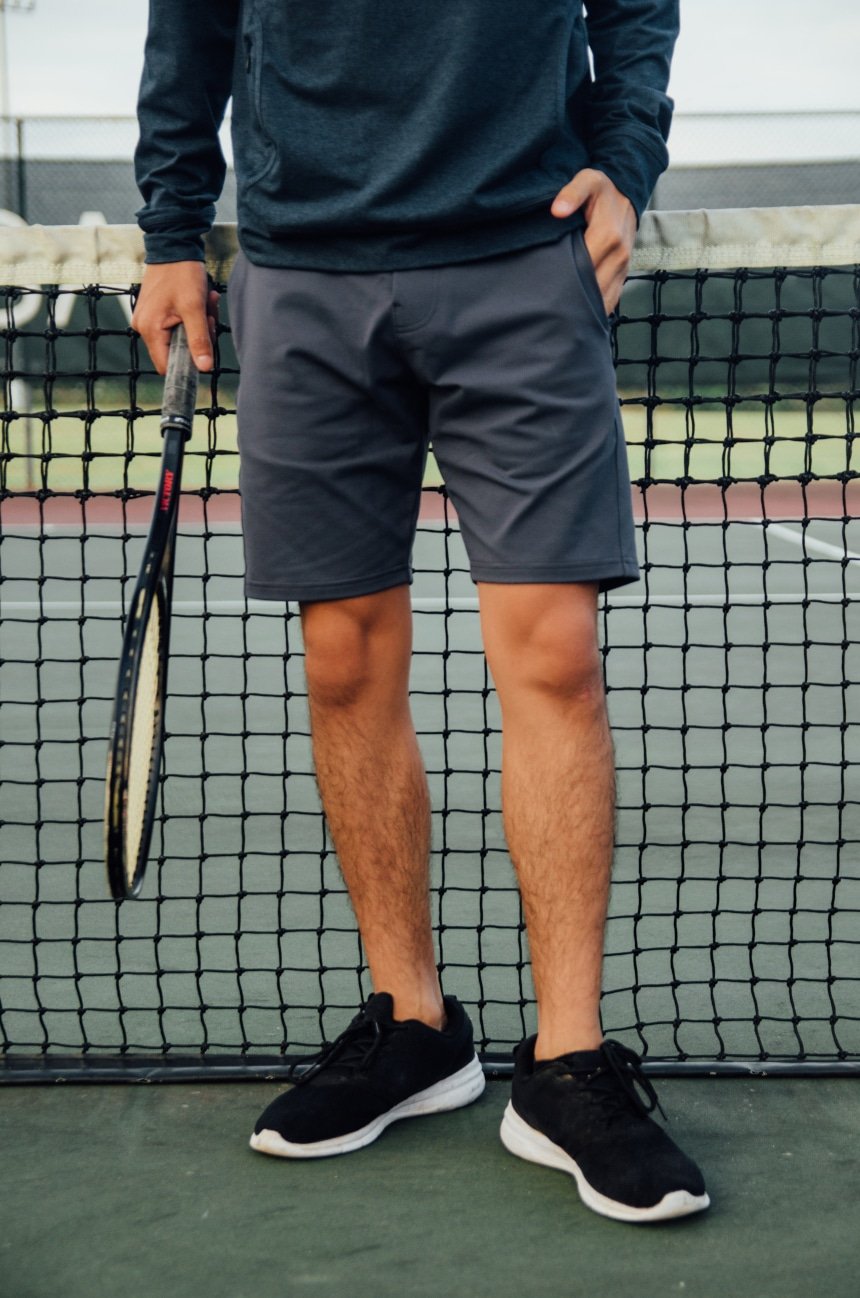 Leg Shot Of Model Wearing Public Rec All Day Every Day Short Holding Tennis Racquet