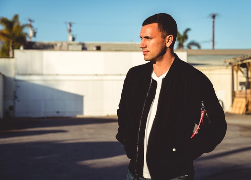 How Military Style Can Level Up Your Closet: The Complete Guide for Men 6 Man in black bomber jacket