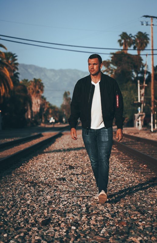 How Military Style Can Level Up Your Closet: The Complete Guide for Men 7 Man in black unzipped bomber jacket