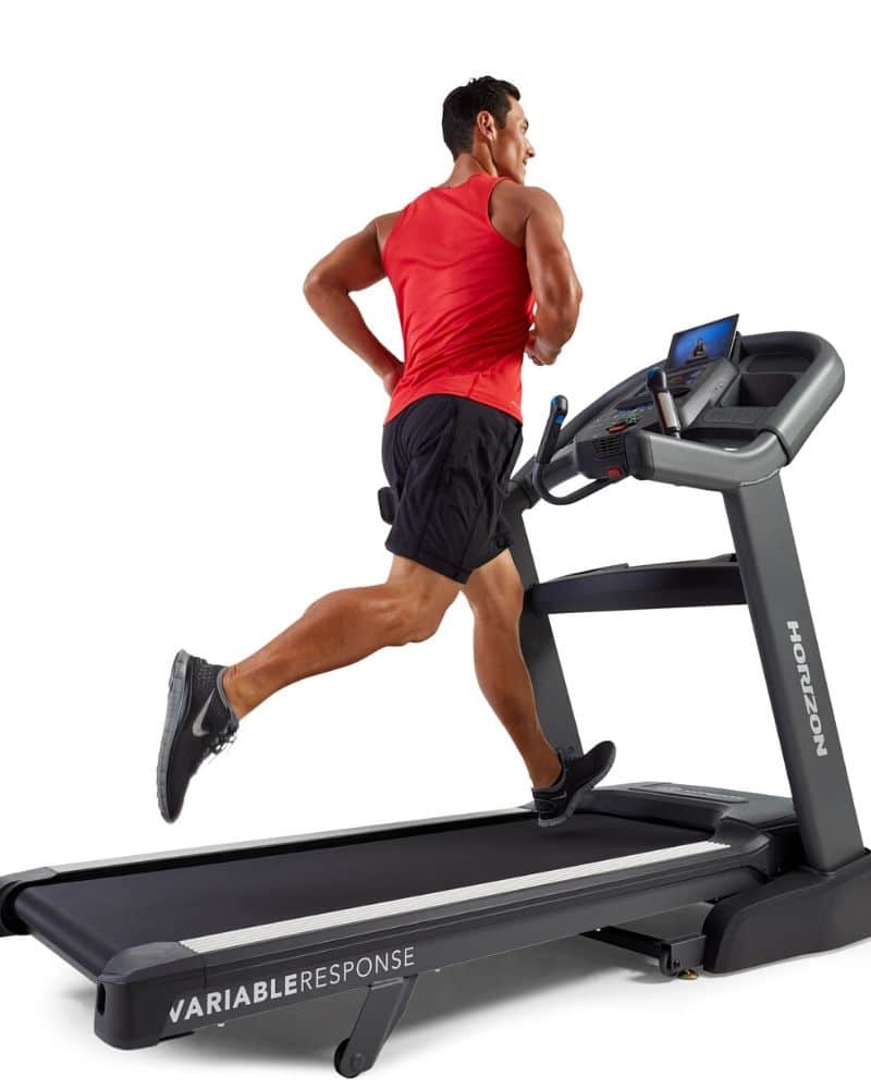 man in red shirt running on treadmill