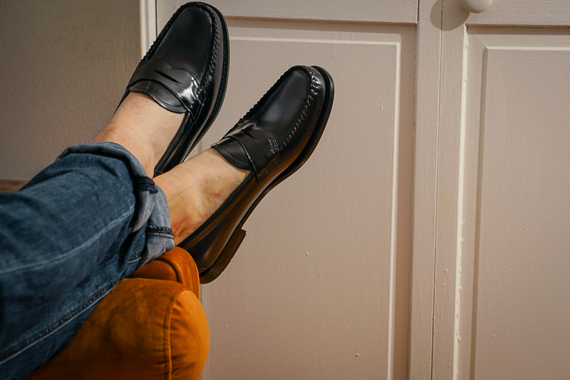 man laying on couch wearing GH Bass shoes