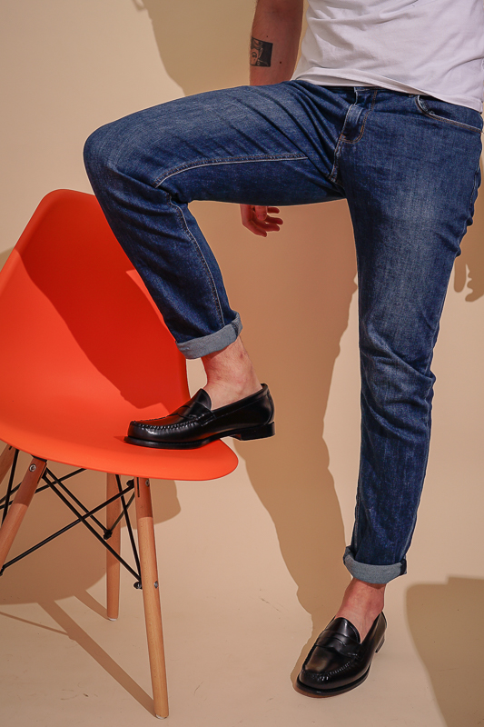 man standing on chair with GH Bass shoes