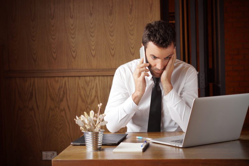 Man stressed out on phone