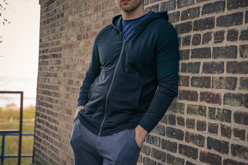 man wearing black Unbound Merino hoodie and sweatpants