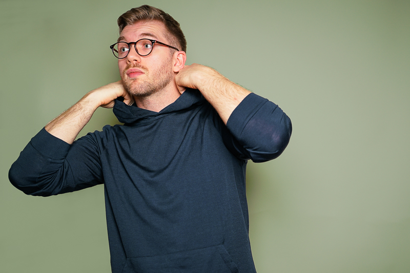 Man Wearing Navy Unboud Merino Hoodie