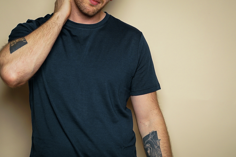 Man Wearing Navy Unboud Merino T Shirt