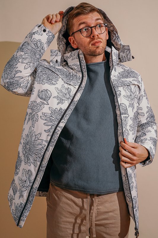 man wearing white Nobis jacket