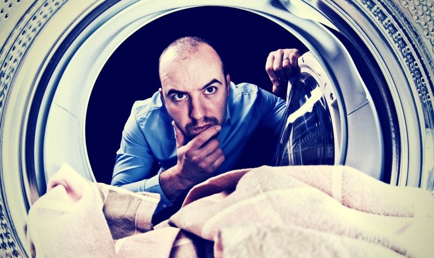 Man with head in dryer trying to figure out how it works
