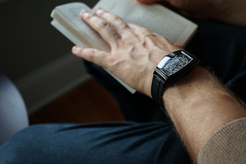 Man with Yonger Bresson Watch Reading