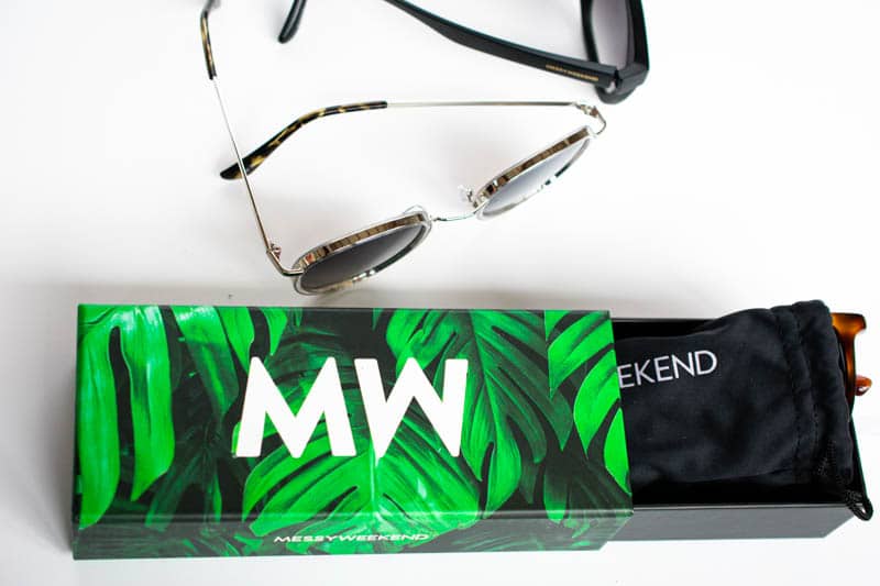 messyweekend packaging with green box black microfiber pouch and three sunglasses