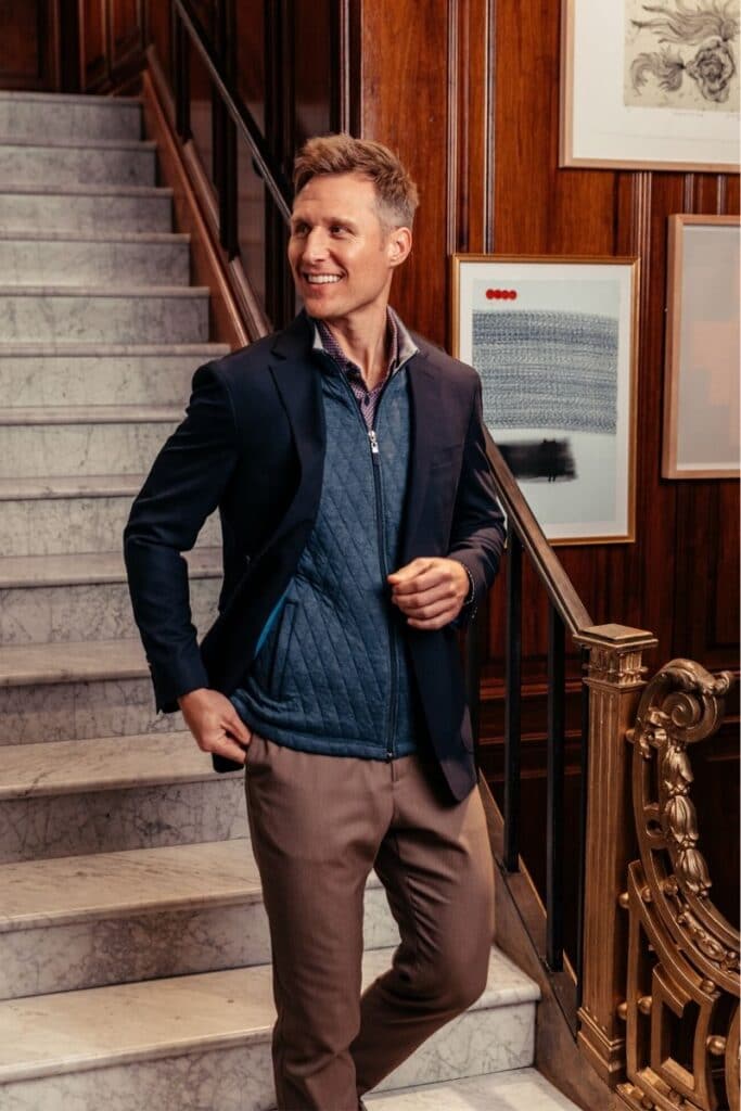 Mizzen and Main Vest Under Blazer Man Walking Down Stairs