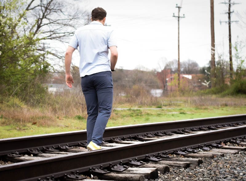 model facing away from camera wearing western rise spring lineup clothes