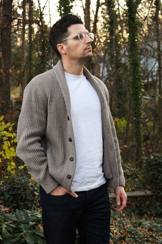 model looking away with white tshirt and dark blue jeans