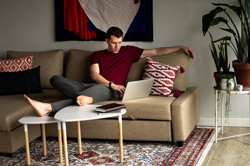 model on couch and computer with meundies loungewear