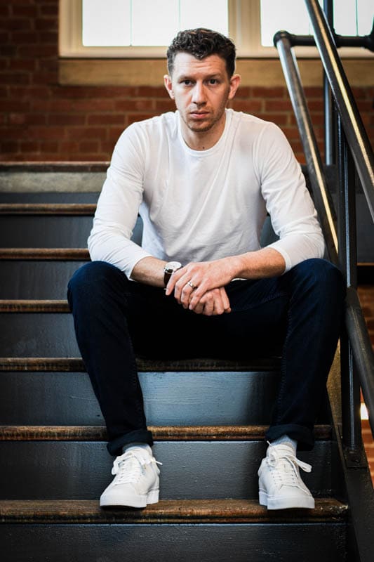 model sitting on stairs in rag and bone outfit