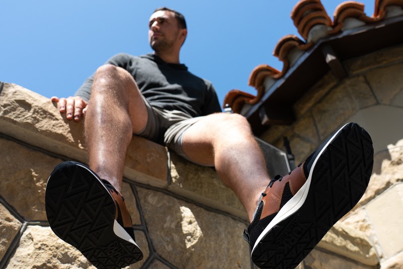 Model sitting on wall in York Athletics