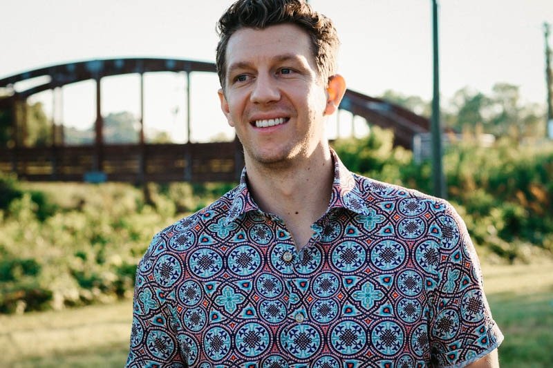 model smiling wearing robert graham short sleeve shirt