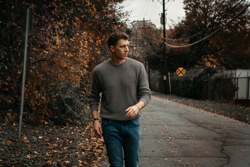 model walking down street wearing grey knit sweater from liverpool los angeles