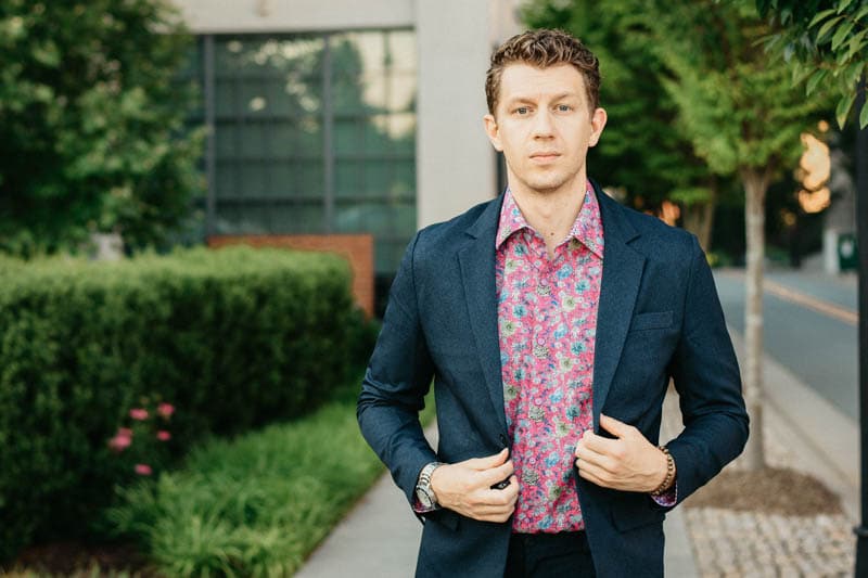 model walking toward camera wearing robert graham shirt