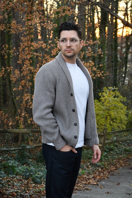 model wearing knit cardigan white tshirt and dark blue jeans