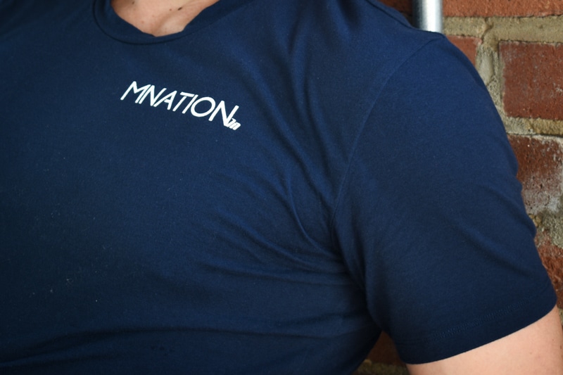 model wearing navy muscle nation shirt