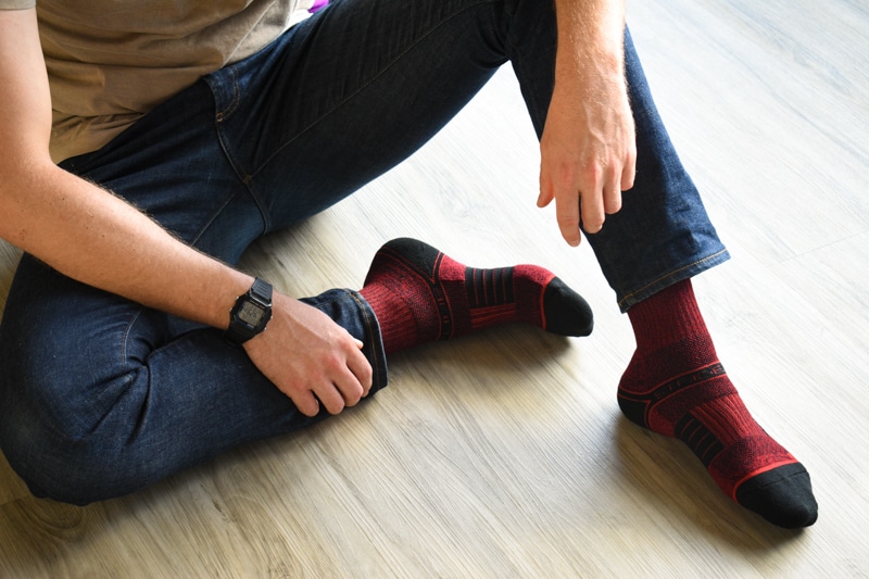 model wearing strideline red ekg socks