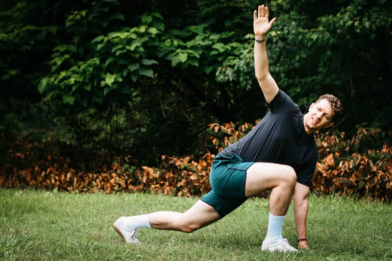 model wearing vuori workout shorts performing yoga move