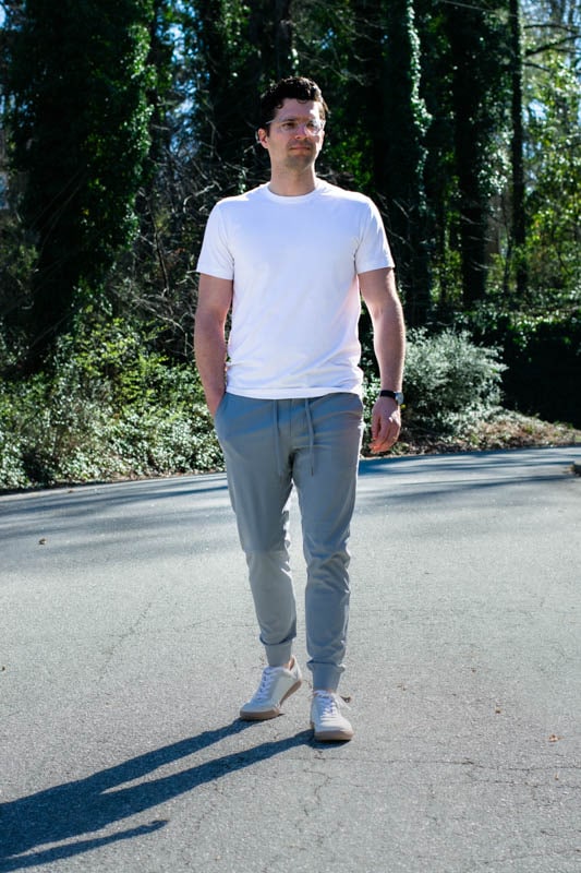 model wearing white t shirt and grey performance joggers