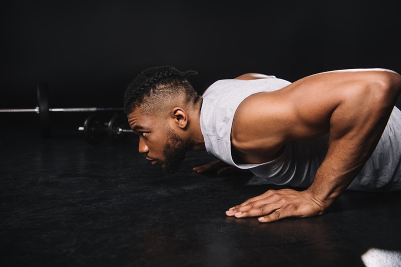 Muscular Man Working Out Doing Pushups