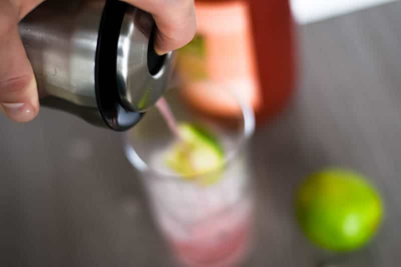 pouring a drink with the oxo shaker
