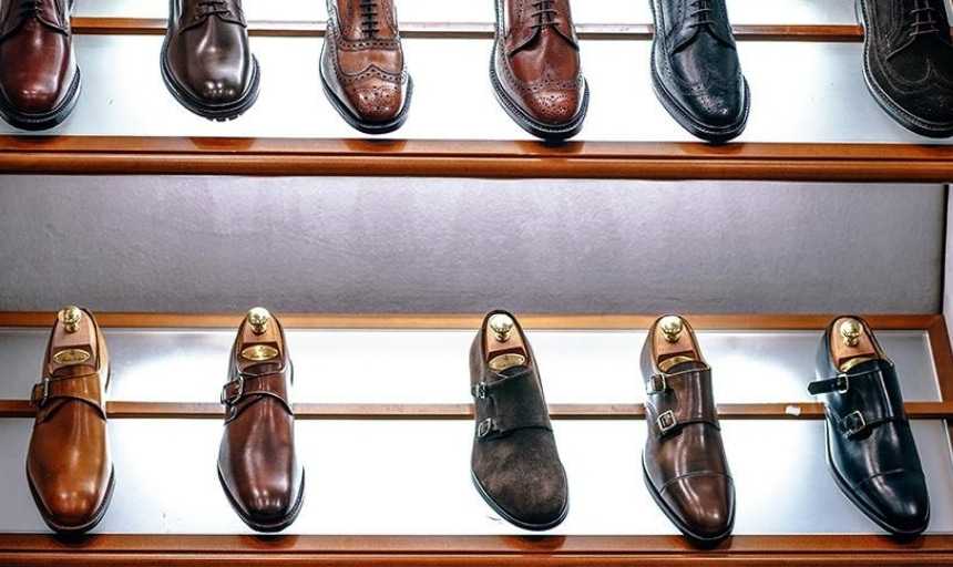 Rows of leather dress shoes in a store
