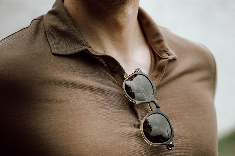 selfmade sunglasses tucked into shirt