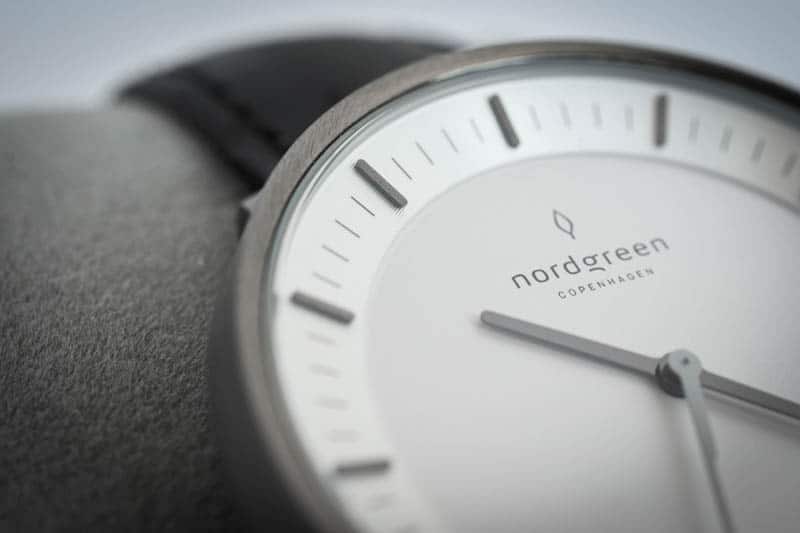 side view nordgreen philosopher logo on white dial indices closeup
