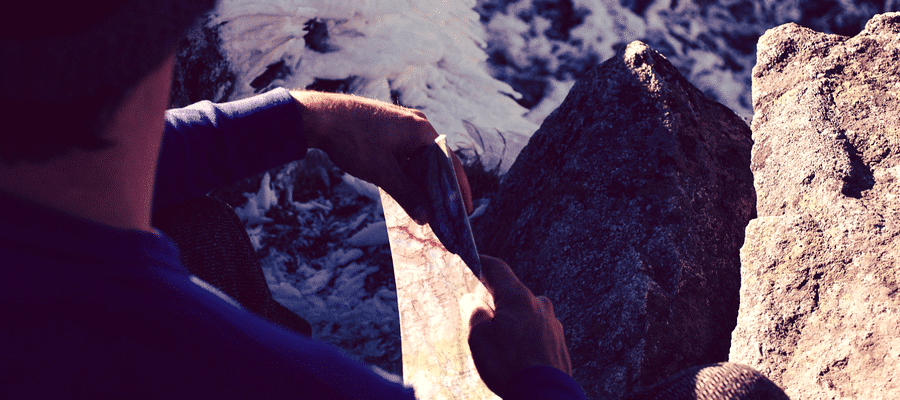 Man in the wilderness with a map