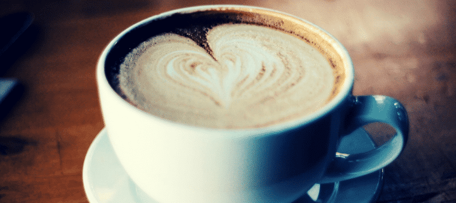 Coffee cappuccino with a heart shaped froth